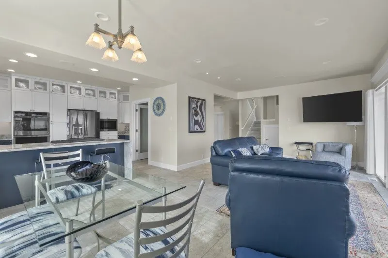 Open-concept living room and kitchen inside an accessory dwelling unit by Doyle Construction